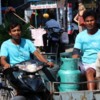 Gas bottle delivery by motorcycle side car