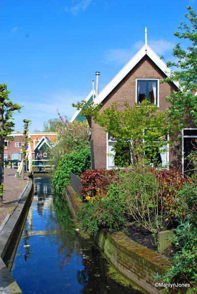 Picturesque houses line narrow canals in Volendam