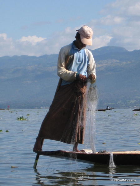 Leg rowing fisherman.