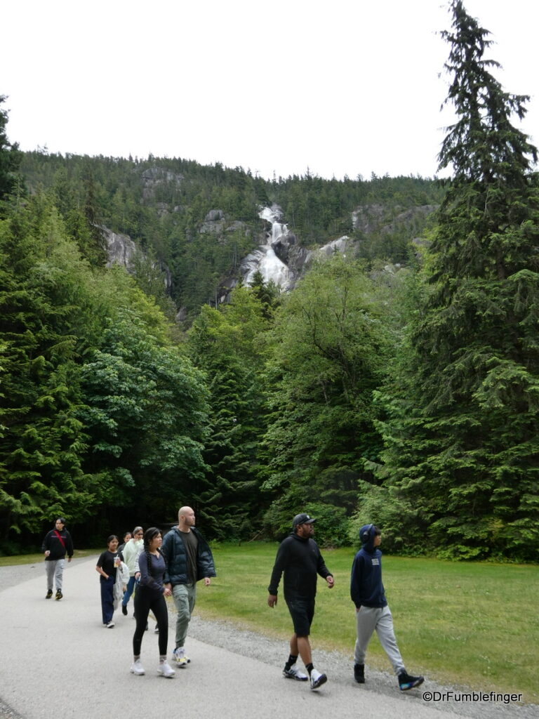 Hikers returning from viewing Shannon Falls (seen in the background)