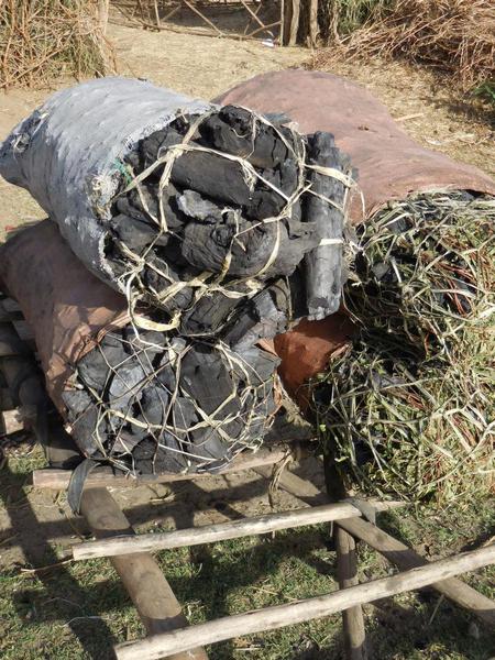 The farmers create charcoal out of wood