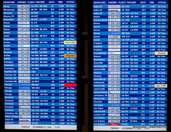 Departure_And_Arrival_Board_At_Dulles_Airport_(4128589658).jpg AlbertHerring-001