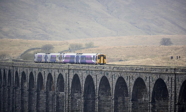 Transpennine diesel loco at Ribblehead viaduct.