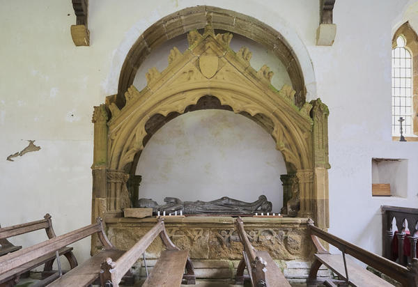 Effigy in tomb surrounds.