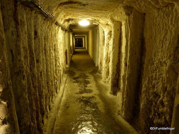 One of the many tunnels in the Wieliczka Salt Mine. Note how moisture has deposited salt on the timbers.